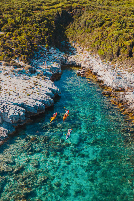 Cape Kamenjak: Kayak Tour with Cave Experience - Entering the cave: turquoise light and a natural pool