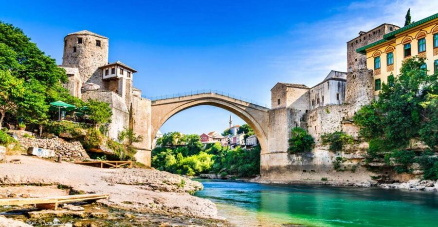 From Split and Trogir: Mostar Tour with Kravica Waterfalls - Mostar walking tour: Stari Most, the Ottoman quarter, and daredevil traditions