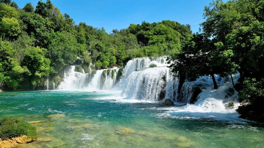 From Split: Krka Waterfalls Tour with Boat Ride & Swimming - Skradin time: walking streets and using the beach