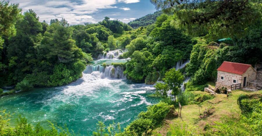 From Split: Krka Waterfalls Tour with Boat Ride & Swimming - The guided waterfall walk: mills, an ethno village, and clear storytelling