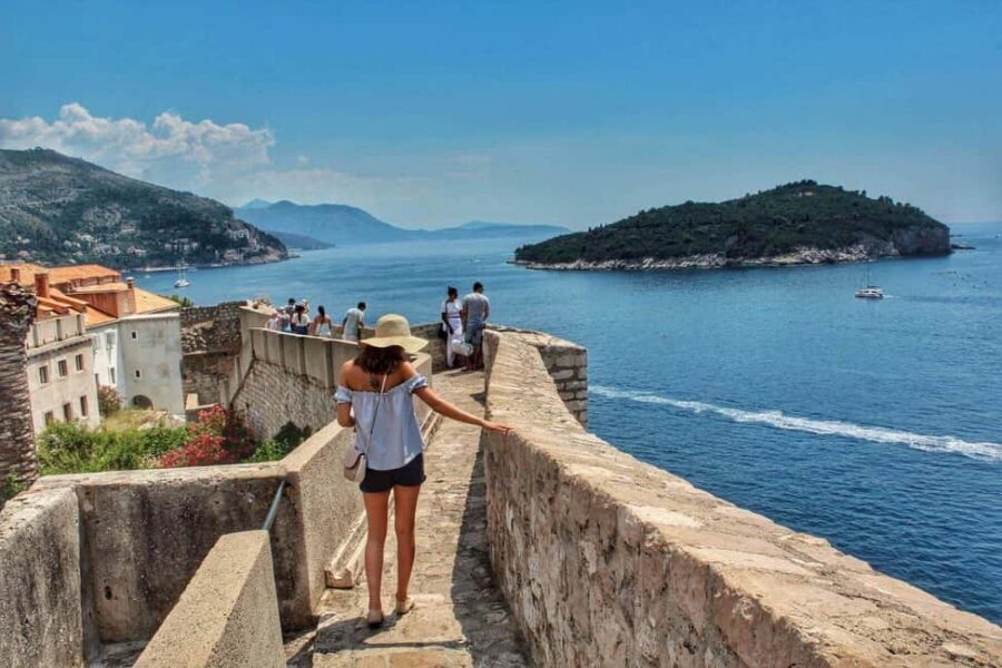From Split/Trogir: Dubrovnik Guided Tour with a Stop in Ston - Entering Dubrovnik: Stradun Promenade and the walls that define the city