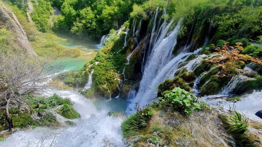 From Zadar: Plitvice Lakes Day Trip with Guide and Boat Tour - Inside the park: wooden paths, waterfalls, and Route B vs Route C