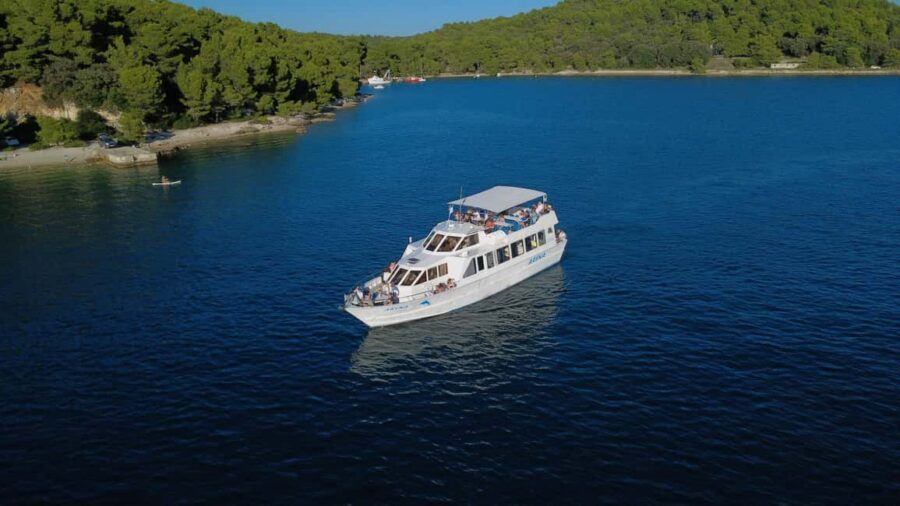 Pula: Brijuni Dolphins Sunset Cruise with Dinner and Drinks - Arena boat comfort: terraces, sundeck, bar, and two toilets